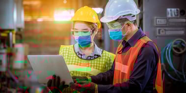 Supply chain workers wearing masks while working