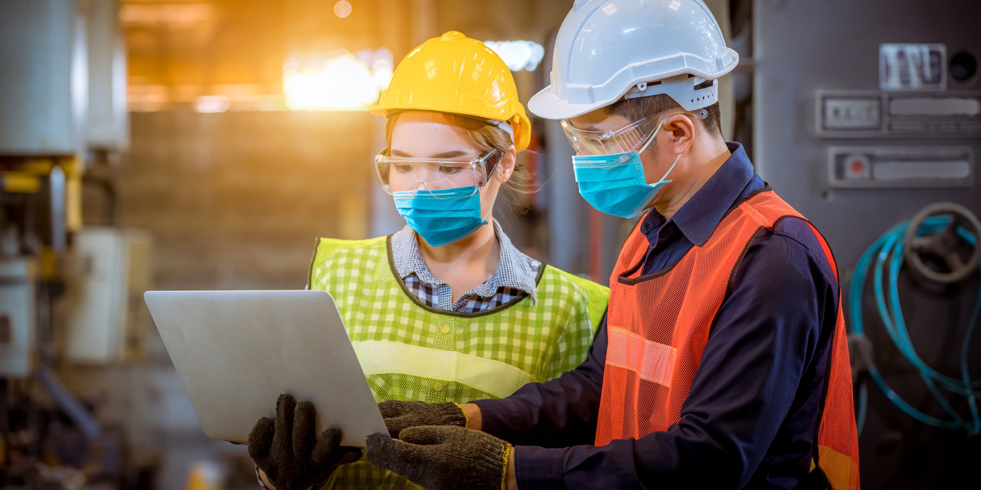 Supply chain workers wearing masks while working